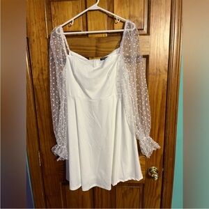 Elegant White Dress with Sheer Polka Dot Sleeves